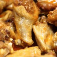 Chicken Wings with Fries · 10 wings tossed in your choice of sauce or plain. Served with your choice of ranch or bleu c...