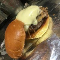 Mushroom Swiss Burger · Mushrooms, grilled onions and Swiss cheese. Served on a hot bun with lettuce, tomato and oni...