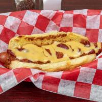 Chili Cheese Dog · Sabrett hot dog topped with home-made chili and velveeta cheese whiz served on a toasted pot...