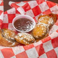 Deep Fried Oreo Cookies · Pancake Batter and Confection Sugar coated Oreo Cookies Fried Golden Brown and dusted with p...
