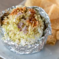 Vegetarian Potato · Baked potato topped with butter, sour cream, monterey jack cheese, diced cabbage, diced red ...