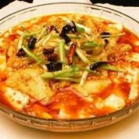 36. Spicy Tofu with Fish Filet / 豆花魚片 · Fish fillets with silken tofu boiled in spicy sauce.