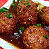 55. Braised Meat Balls in Soy Sauce / 紅燒獅子頭 · Meat balls braised in soy sauce on top of bok choys.