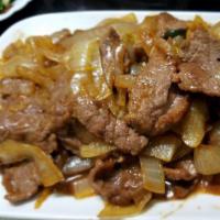 58. Mongolia Beef / 蒙古牛肉 · Beef slices stir fried with onions.