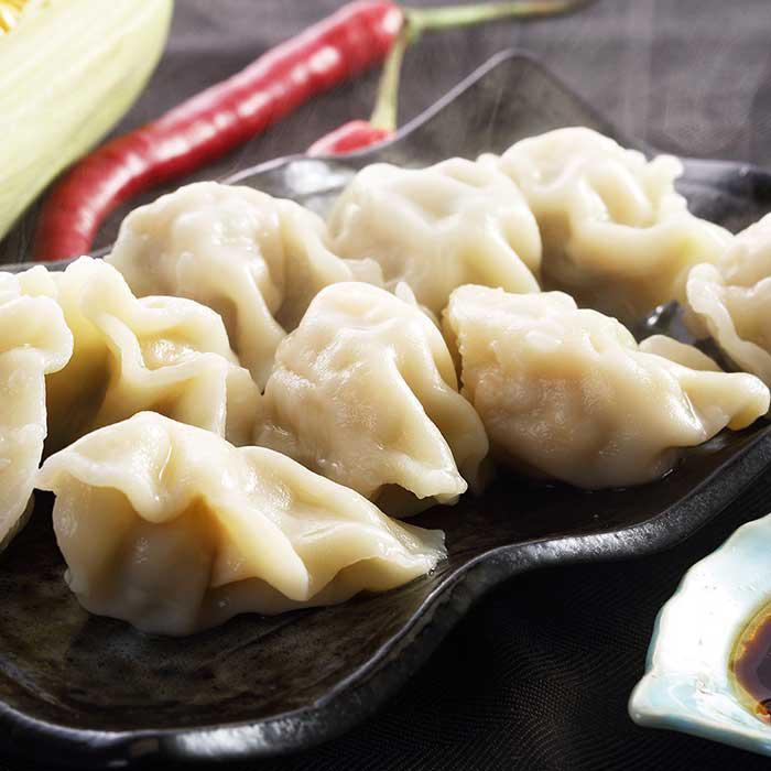 85. Homemade Dumplings / 手工大水餃(白菜豬肉) · 12 pieces of boiled dumplings stuffed with pork and Chinese cabbage.