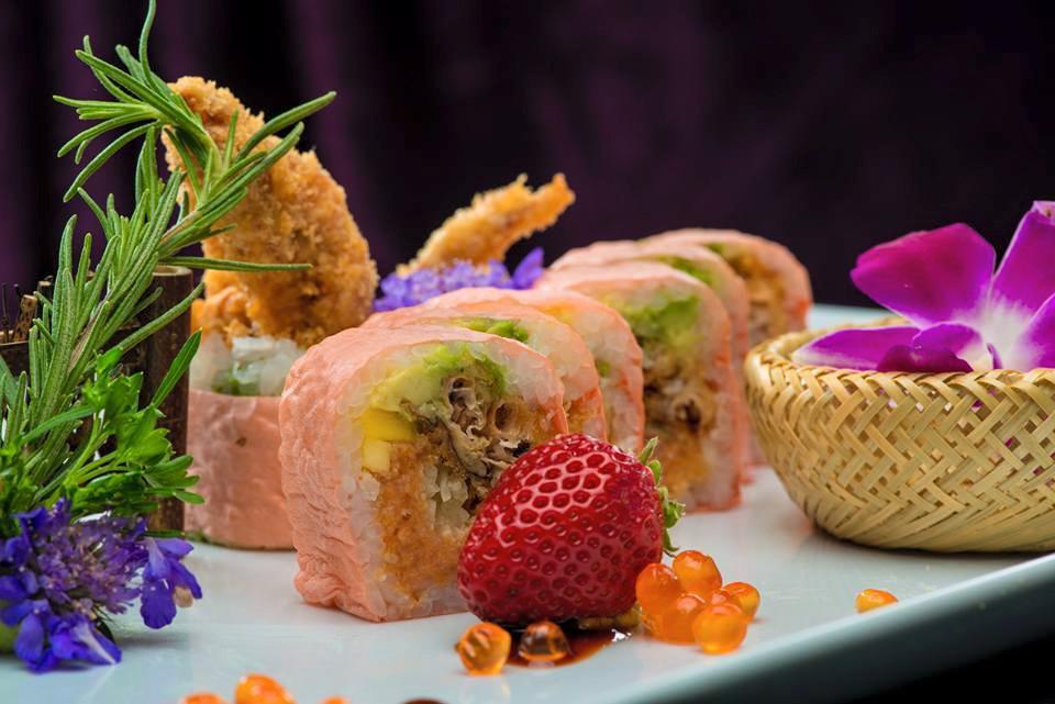 Spiderman Roll · 8 pieces. Soft shell crab tempura, spicy tuna, crunch, masago, mango, avocado and cucumber wrapped with soy bean paper, eel sauce.
