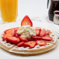 Strawberry Waffles · Lightly dusted with powdered sugar.