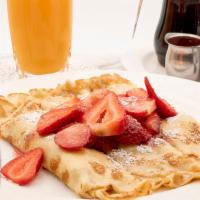French Crepe · With fresh strawberries. Lightly dusted with powdered sugar.