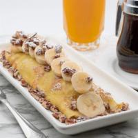 Coffee Maple Banana Crepe · Fresh bananas and coffee-maple glaze, topped with bananas and pecans. Lightly dusted with po...