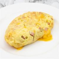 Ham and Cheddar Omelette · With our signature French rolled, oven-baked, four egg omelette, and choice of side.