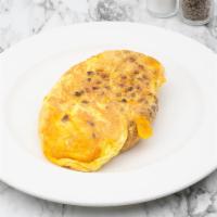 Chorizo and Cheddar Omelette · Spicy. With our signature French rolled, oven-baked, four egg omelette, and choice of side.