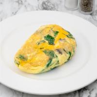 Spinach, Cheddar and Mushroom Omelette · Fresh baby spinach, sauteed mushrooms and aged cheddar. With our signature French rolled, ov...