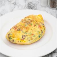 Fiesta Cheddar Omelette · Bacon, onion, jalapeno, tomato and aged cheddar. Spicy. With our signature French rolled, ov...