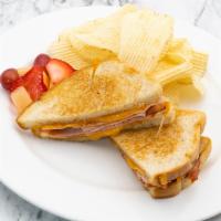 Grilled Ham and Cheese Sandwich · Shaved ham and melted cheddar on sourdough.