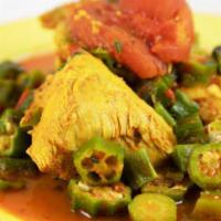 Chicken with Okra · Chicken stew with hearty okra in a light tomato broth. Served with Rice & Beans