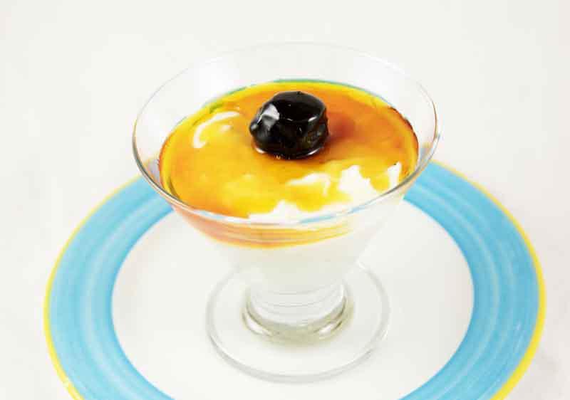 Creamy Coconut Pudding · Served with caramel and prunes.