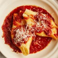 Stuffed Shells · 4 Large shells stuffed with ricotta cheese and topped with homemade marinara sauce and mozza...
