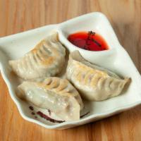 Pot Stickers - 煎锅贴  · Pork and vegetable dumplings steamed, then pan seared