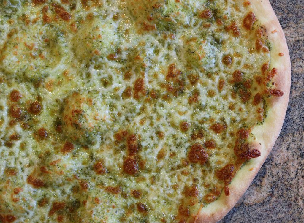 Pesto Pizza · Cheesy pesto pizza.