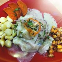 Lima Style Ceviche · All fish ceviche with sweet potato, sliced red onion, cilantro, and corn.