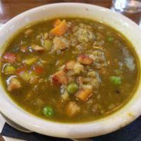 Aguadito Soup · Chicken and rice soup with cilantro broth, bell peppers, peas, and carrots.