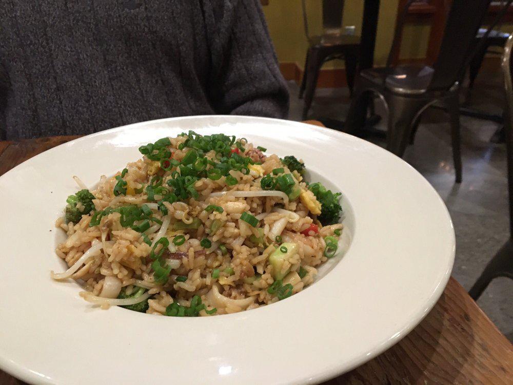 Stir Fried Rice with Chicken · Arroz chaufa. Gluten-free. Stir fried rice mixed with broccoli, green onions, mushrooms, bell peppers, cilantro, bean sprouts, soy sauce, sesame oil, and egg.