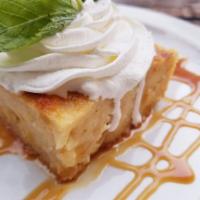 Bread Pudding · Pineapple and coconut bread pudding served with bourbon caramel sauce and whipped cream.