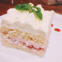 Tres Leches · Strawberry sauce.