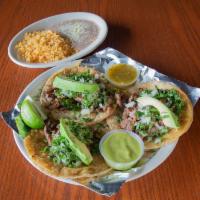Tacos Pancho · Three authentic tacos with your choice of meat topped with cilantro onions and avocado