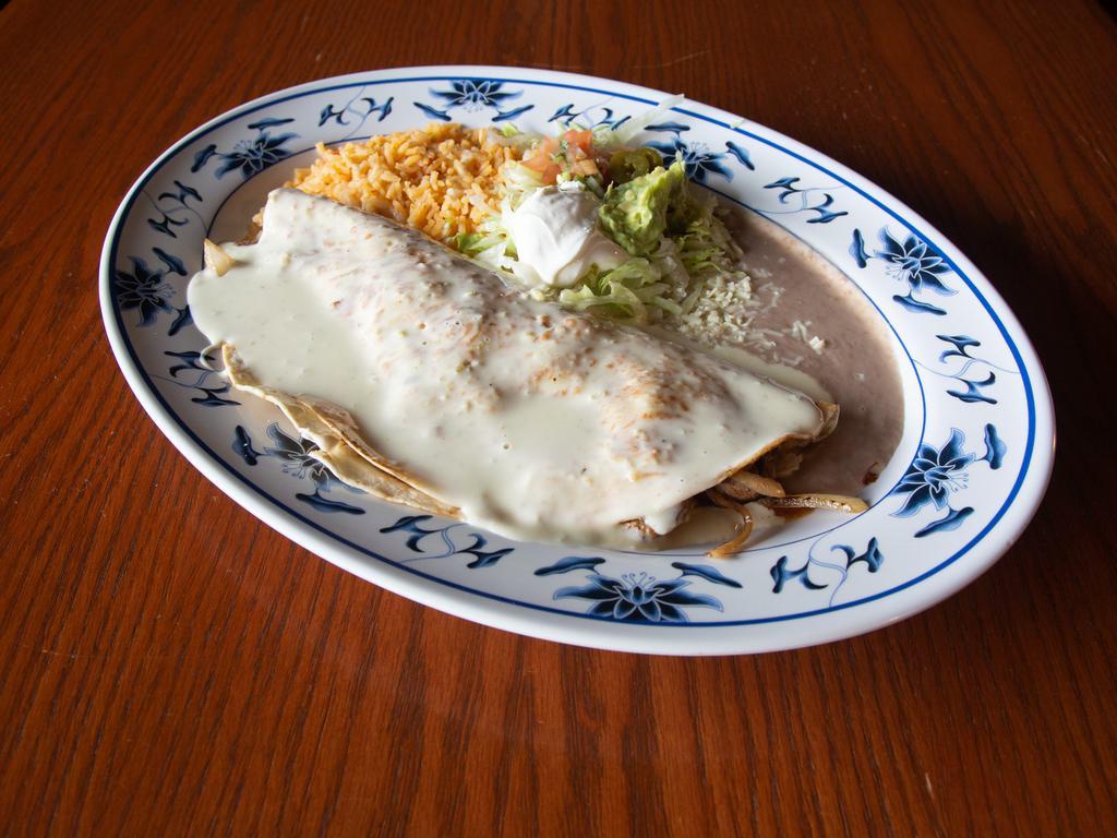 Quesadilla Fajita · Quesadilla stuffed with cheese your choice of meat and grilled onions tomatoes and bell pepper  cover in cheese sauce served with rice and beans and gucamole salad