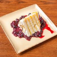 Lemon Meringue Cake · Toasted meringue, berry coulis.