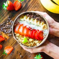 Acai Boost Bowl · Base: Acai, Strawberry Banana
Topping: Granola, Strawberries, Bananas and Coconut Flakes