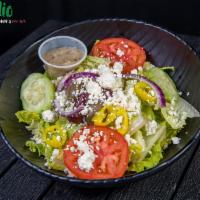 Greek Salad · Variety of greens, tomatoes, cucumber, onions, feta cheese and olive oil.