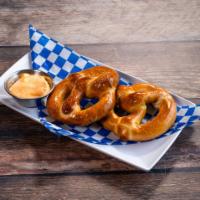 2 Pretzels · Served warm with beer cheese sauce.
