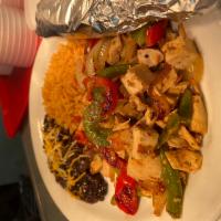 Fajita Plate · A choice of steak or chicken grilled over bell peppers and onions with guacamole and sour cr...