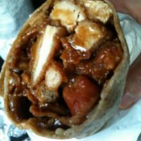 Beast Wrap · Chicken cutlet with bacon, Swiss, brown gravy and onion rings on a garlic wrap.