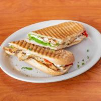 Chicken Italiano Panini · Grilled chicken, homemade pesto sauce, fresh mozzarella and roasted red peppers. 