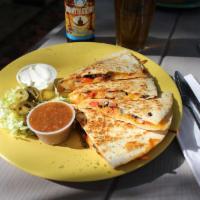Sweet Chili Lime Shrimp Quesadilla · Grilled shrimp cooked with lime juice, roasted red peppers, black beans, shredded cheddar ja...