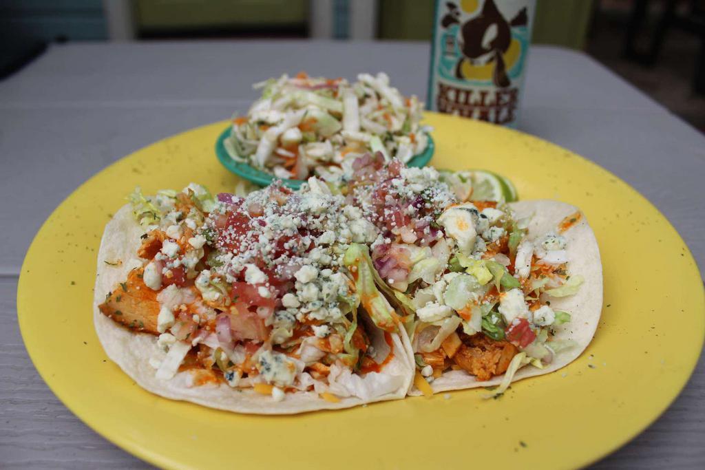 Buffalo Chicken Tacos · Our fresh grilled chicken tossed in our Buffalo sauce, shredded cheddar Jack cheese, pico de gallo, lettuce and Gorgonzola crumbles with a drizzle more of our Buffalo sauce.