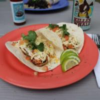 Dynamite Shrimp Tacos · Our large shrimp covered in our cabbage and dynamite sauce mix, shredded cheddar jack cheese...