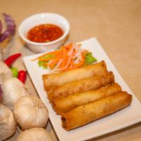A4. Vegetarian Egg Rolls · Crispy rolls with taro, onion, carrot, green bean, and a side of fish sauce or peanut sauce.