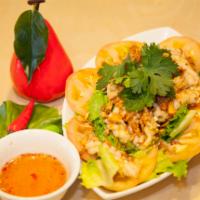 A8. Thai Spicy Squid Salad · Mixing of squid, lettuce, tomato and Thai spicy sour sauce.