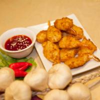 A12. Fried Shrimp · 10 pieces. Deep-fried shrimps served with sweet chili sauce.
