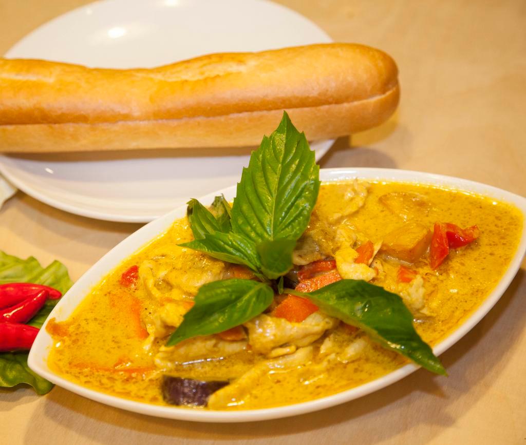 R6. Curry Chicken · Cooked chicken, sweet potatoes, eggplant, carrot, with curry paste and coconut milk. It serves with steam rice or French bread or vermicelli noodle.