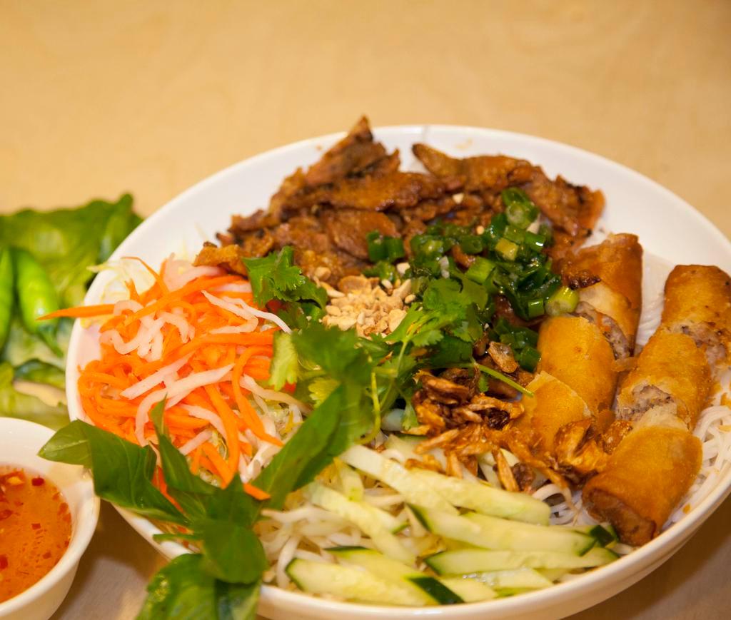 V2. Bun Thit Nuong Cha Gio · Grilled pork and egg rolls serve with vermicelli dish.