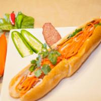 B4. Banh Mì Nem Nuong · Vietnamese sausage patty comes with mayonnaise, Vietnamese pickle, cilantro, cucumber and ja...