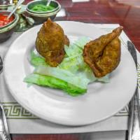 Lamb Keema Samosa · Crisp pastry stuffed with delicately spinach, onions, and paneer.