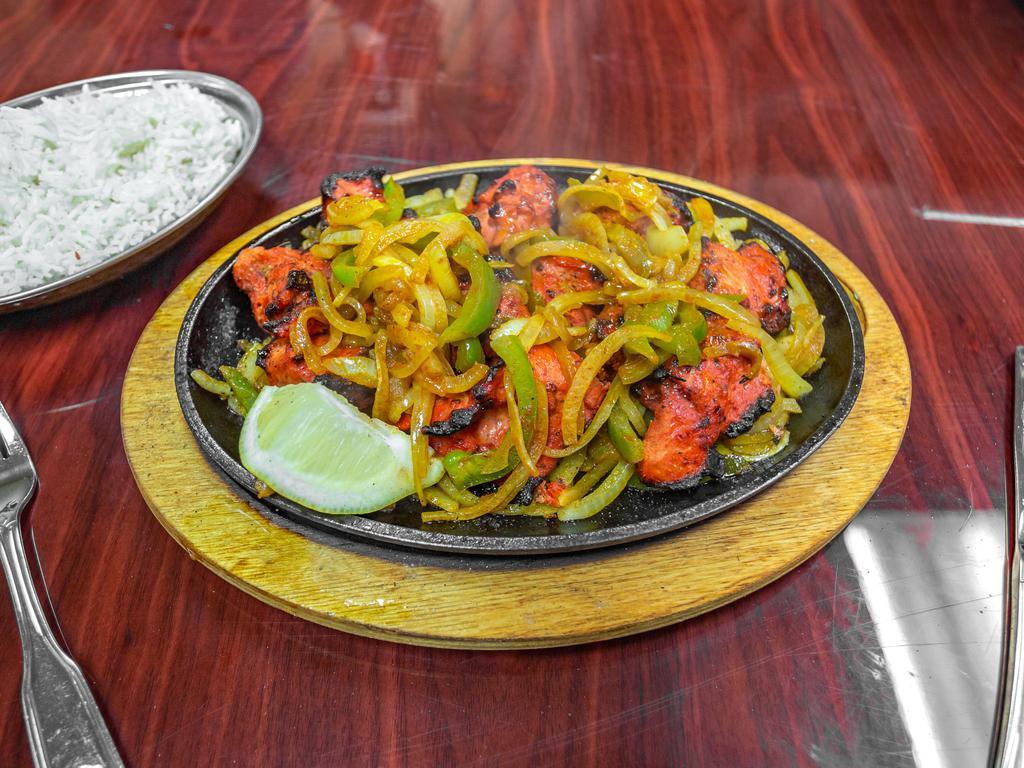 Chicken Tikka Special · Cubes of boneless, skinless chicken marinated in a blend of spices and cooked on the skewers in a clay oven.
