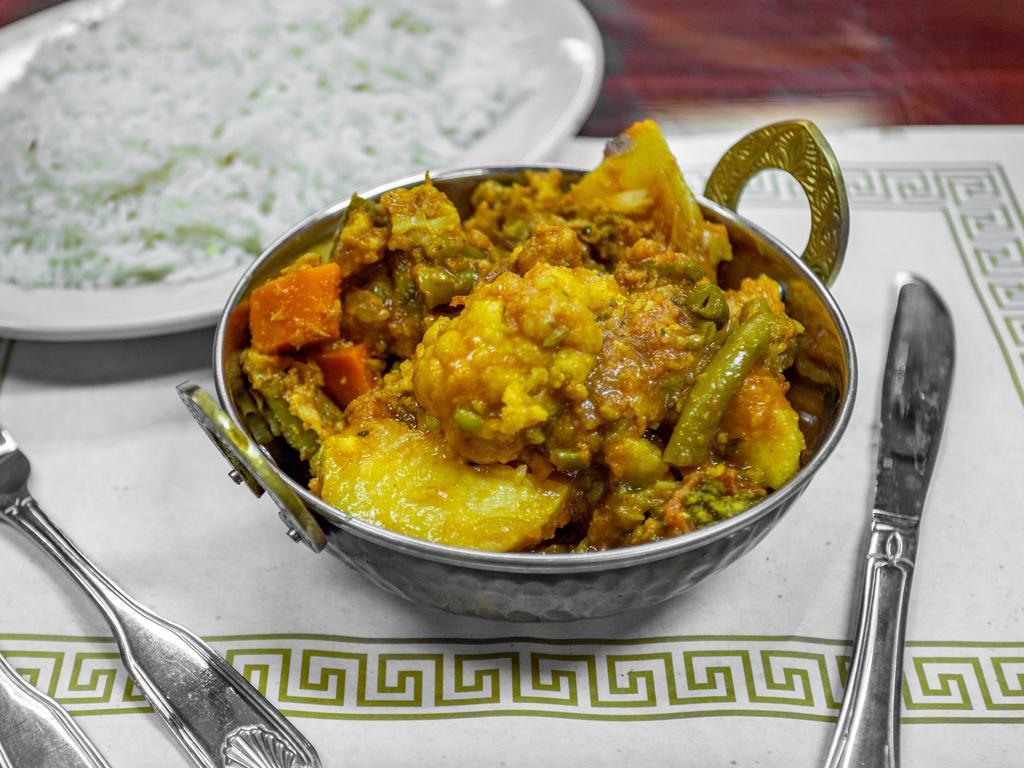 Mixed Vegetable Curry · Mixed vegetables cooked in a curry made from onions, ginger,garlic and spices.