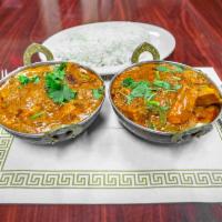 CHICKEN TIKKA MASALA · Pieces of Marinated chicken baked in a tandoor then, sauteed creamy sauce with tomatoes, oni...